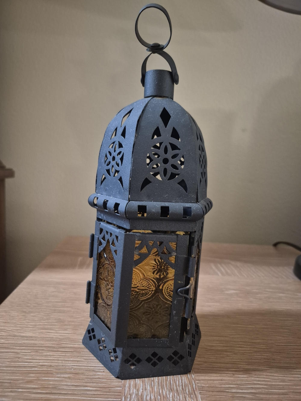 Black Metal Lantern with Amber Glass Accents and Hanging Ring